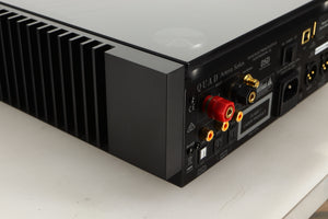 Rear left corner view of a used Quad Artera Solus Integrated System in Silver finish