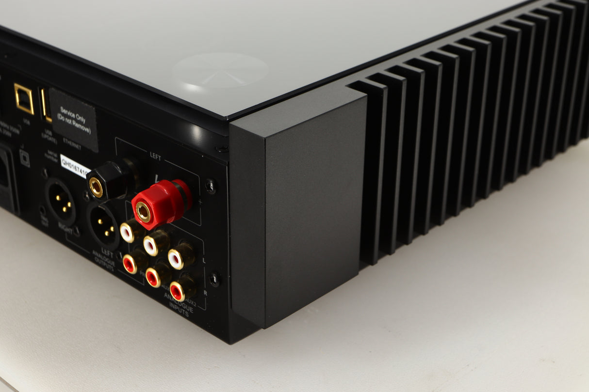 Rear right corner view of a used Quad Artera Solus Integrated System in Silver finish