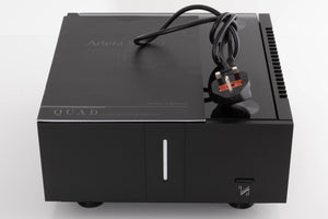 Top of a used Quad Artera Stereo Power Amplifier in a Black finish showing Mains Cable and Manual
