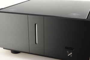 Close up of a used Quad Artera Stereo Power Amplifier in a black finish showing some of the fascia