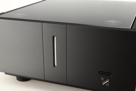 Close up of a used Quad Artera Stereo Power Amplifier in a black finish showing some of the fascia