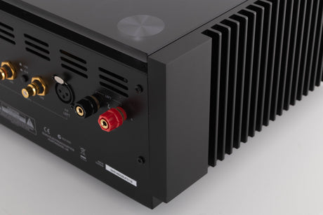 Rear left corner of a used Quad Artera Stereo Power Amplifier in a Black finish