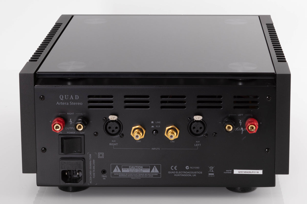 Rear view of a used Quad Artera Stereo Power Amplifier in a Black finish showing Mains Input, Speaker Outputs, XLR Inputs and Phono Inputs