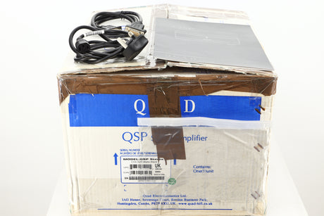 Box of a used Quad Elite QSP Power Amplifier showing mains cable, manual, and ampbus cable