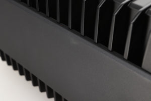Close up view of a used Quad Elite QSP Power Amplifier showing an abrasion on the left side