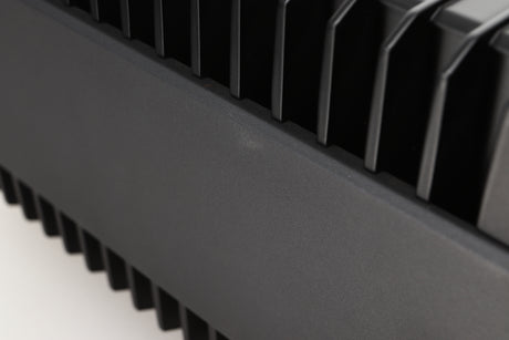 Close up view of a used Quad Elite QSP Power Amplifier showing an abrasion on the left side
