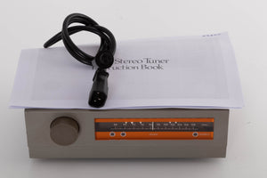Top of a used Quad FM3 Tuner showing Manual and Power Cable