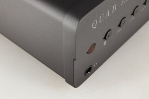 Close up of a used Quad Vena Integrated Amplifier in a lancaster grey finish showing small chip on front right corner