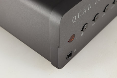 Close up of a used Quad Vena Integrated Amplifier in a lancaster grey finish showing small chip on front right corner