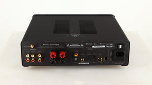 Rear view of a used Quad Vena Integrated Amplifier in a lancaster grey finish showing Phono Inputs, Phono Outputs, Optical Inputs, Optical Output, USB Inputs, Speaker Outputs and Mains Input 