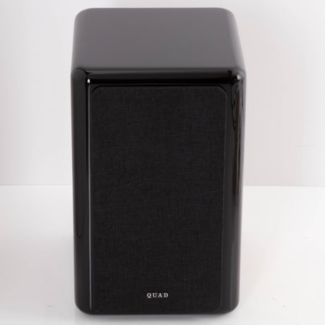 Front view of a used Quad Revela 1 Standmount Speaker in a Walnut finish showing Grille