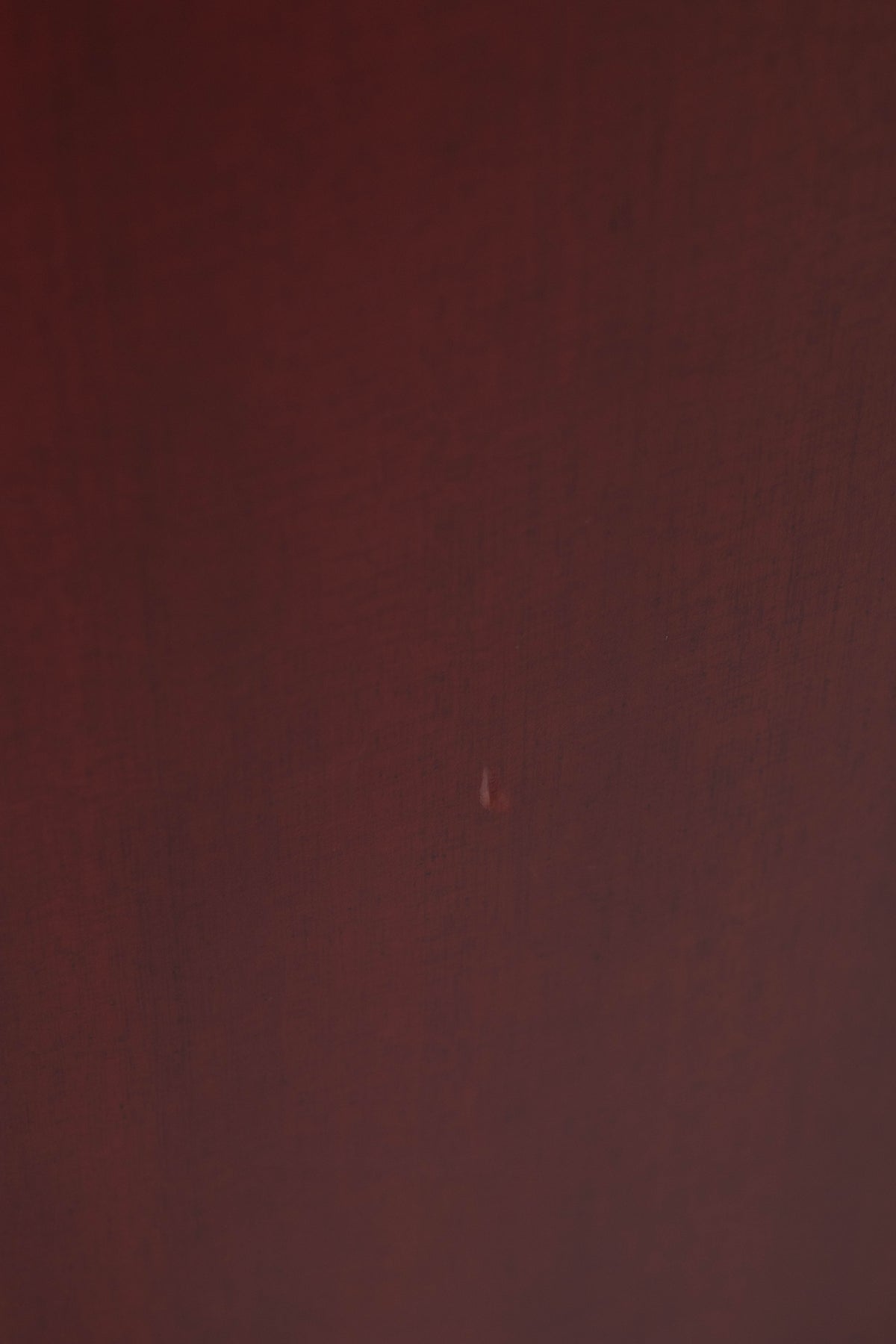 Close up of a used Quad S-4 Floorstanding Speaker in a Sapele Mahogany finish showing small dink in cabinet