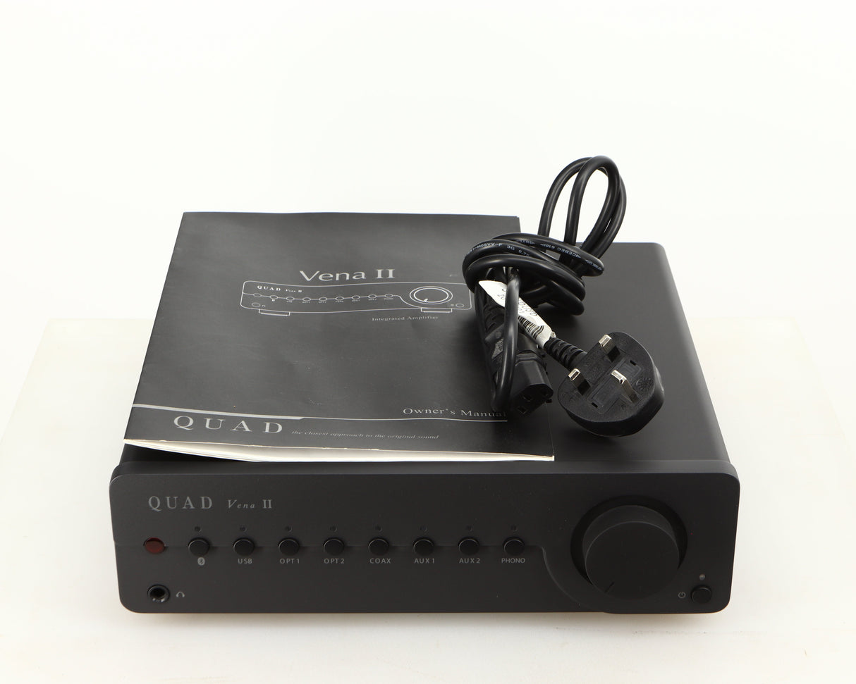 Top of a used Quad Vena II Integrated Amplifier in a lancaster grey finish showing Manual and Mains Cable