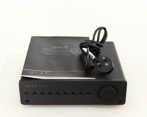Top of a used Quad Vena II Integrated Amplifier in a lancaster grey finish showing Manual and Mains Cable