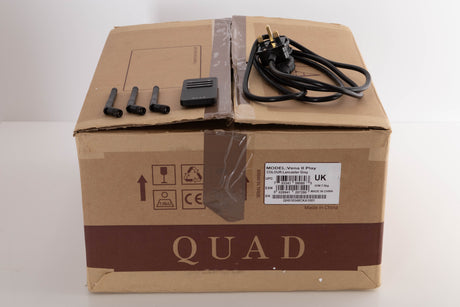 Box of a used Quad Vena II Play Integrated Amplifier in Lancaster Grey with mains cable, remote, and 3x antenna