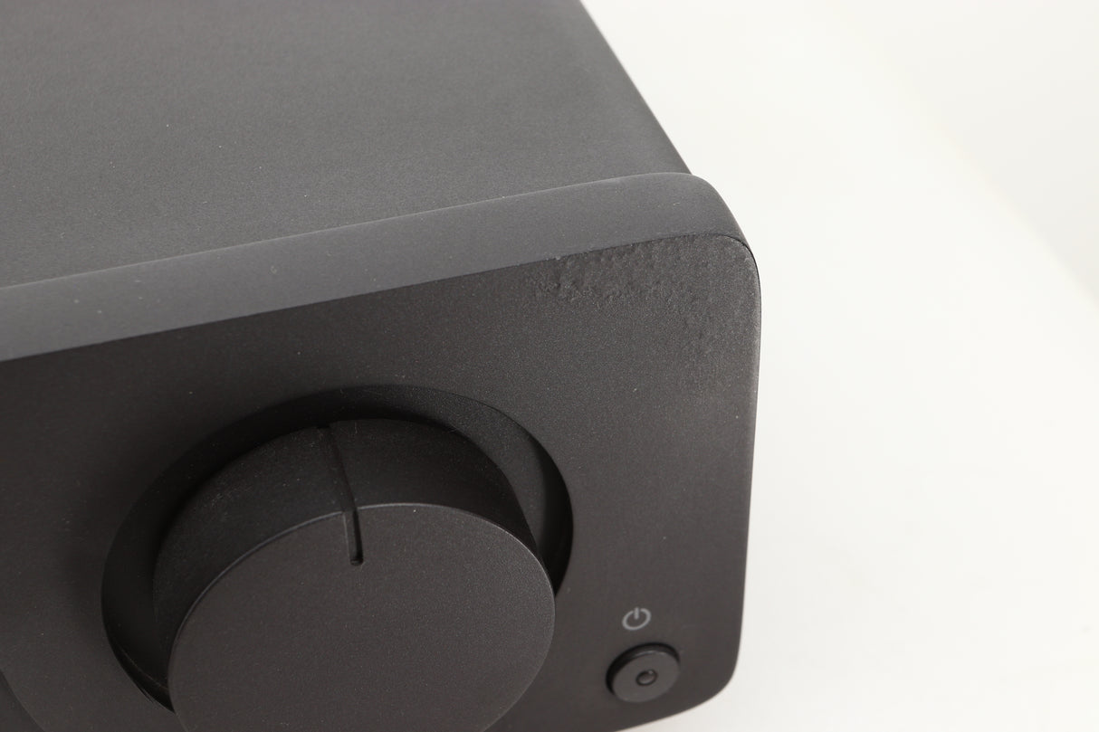Close up view of a used Quad Vena Integrated Amplifier in Lancaster Grey finish showing the right side of the fascia where the texture in the corner seems abnormal