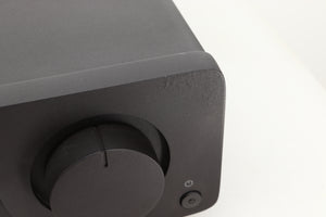Close up view of a used Quad Vena Integrated Amplifier in Lancaster Grey finish showing the right side of the fascia where the texture in the corner seems abnormal
