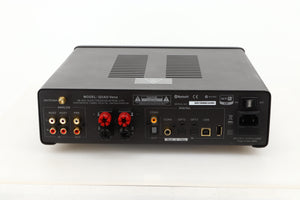 Rear view of a used Quad Vena Integrated Amplifier in Lancaster Grey finish showing RCA, coax, optical, USB, and mains inputs, RCA, coax, optical, and speaker outputs