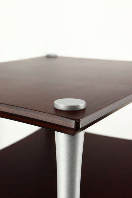 Close up of a used Quadraspire Q4 EVO Hifi Support in a dark cherry finish showing small chip on one corner