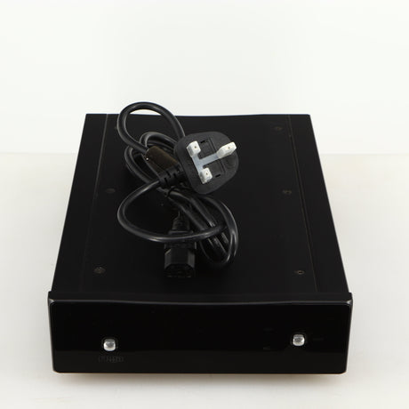 Top of a used Rega Aria MK2 Phonostage in a black finish showing Mains Cable