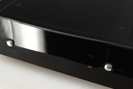Close up of a used Rega Aria MK2 Phonostage in a black finish showing scratching on the screen