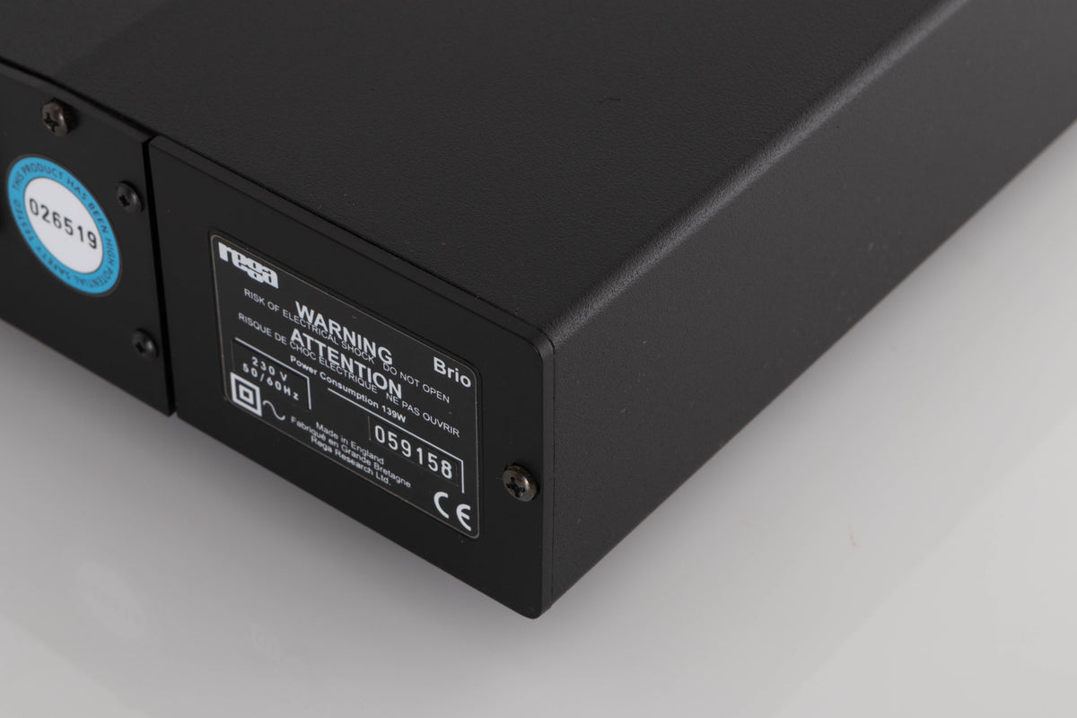 Rear left corner of a used Rega Brio Integrated Amplifier in a Black finish