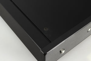 Close up of a used Rega Brio-R Integrated Amplifier in a black finish showing a mark on top