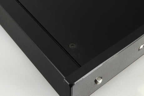 Close up of a used Rega Brio-R Integrated Amplifier in a black finish showing a mark on top