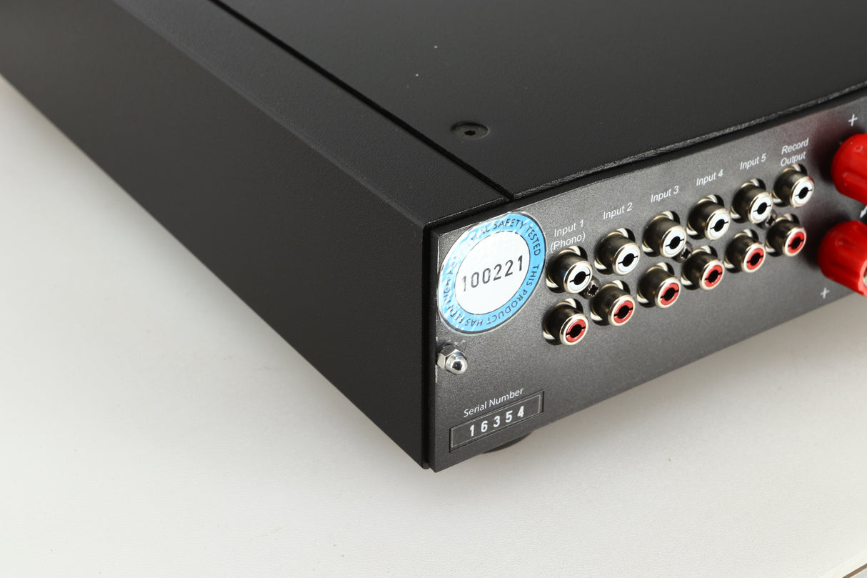 Rear right corner of a used Rega Brio-R Integrated Amplifier in a black finish