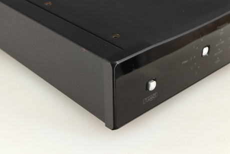 Front left corner of a used Rega DAC Digital Analogue Converter in a black finish