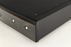 Front right corner of a used Rega DAC Digital Analogue Converter in a black finish