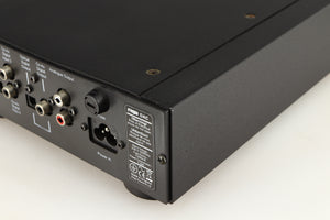 Rear left corner of a used Rega DAC Digital Analogue Converter in a black finish