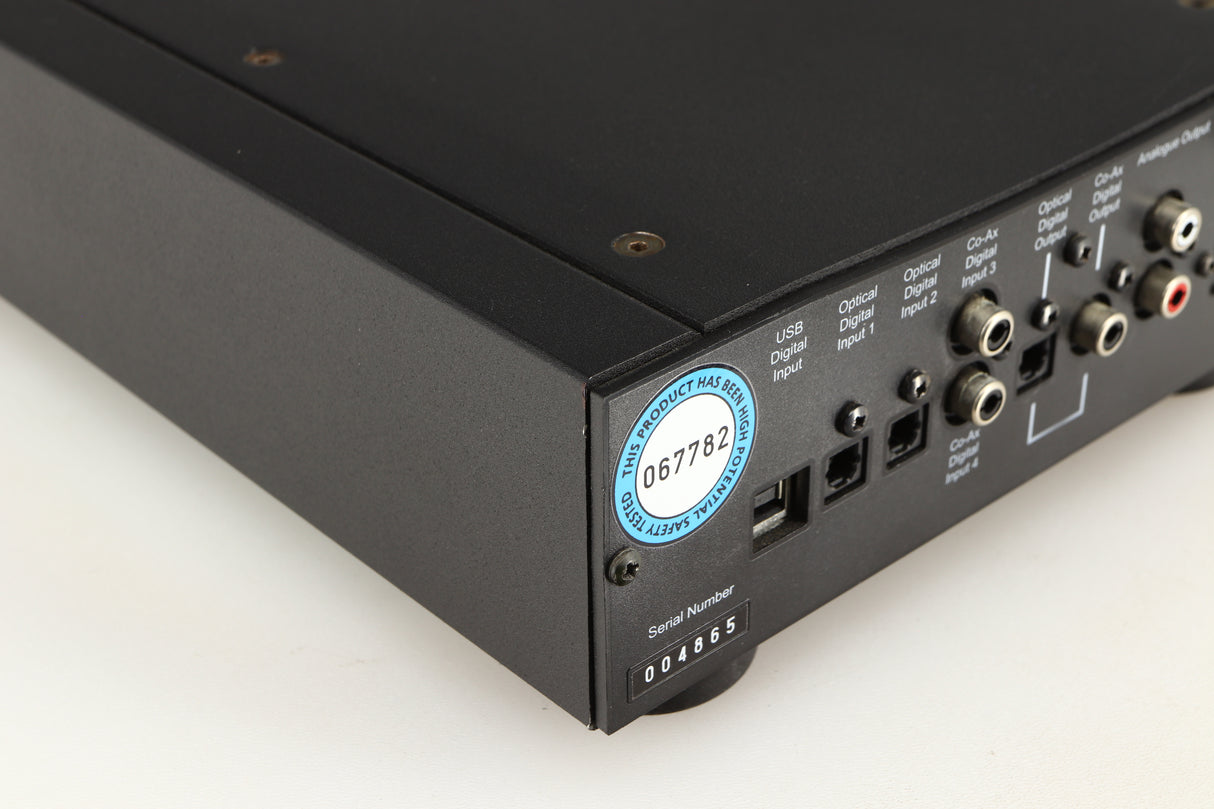 Rear right corner of a used Rega DAC Digital Analogue Converter in a black finish