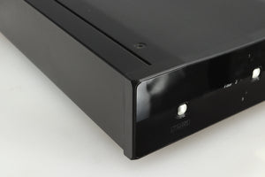 Front left corner of a used Rega DAC-R Digital Analogue Converter in a black finish