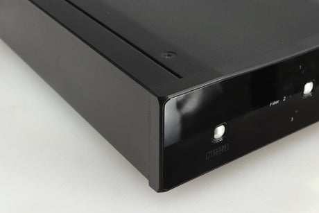Front left corner of a used Rega DAC-R Digital Analogue Converter in a black finish