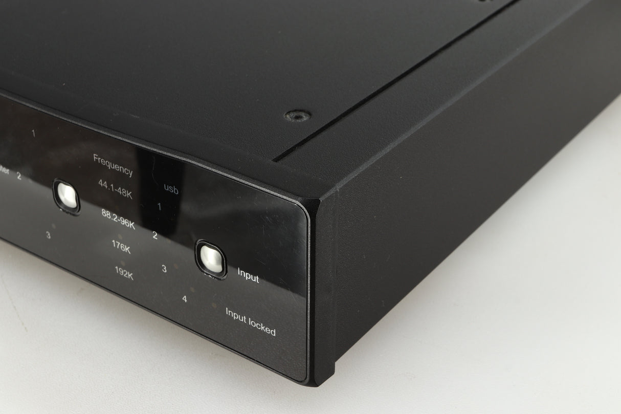 Front right corner of a used Rega DAC-R Digital Analogue Converter in a black finish