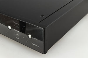 Front right corner of a used Rega DAC-R Digital Analogue Converter in a black finish