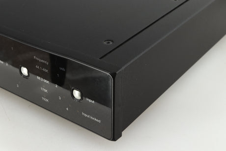 Front right corner of a used Rega DAC-R Digital Analogue Converter in a black finish