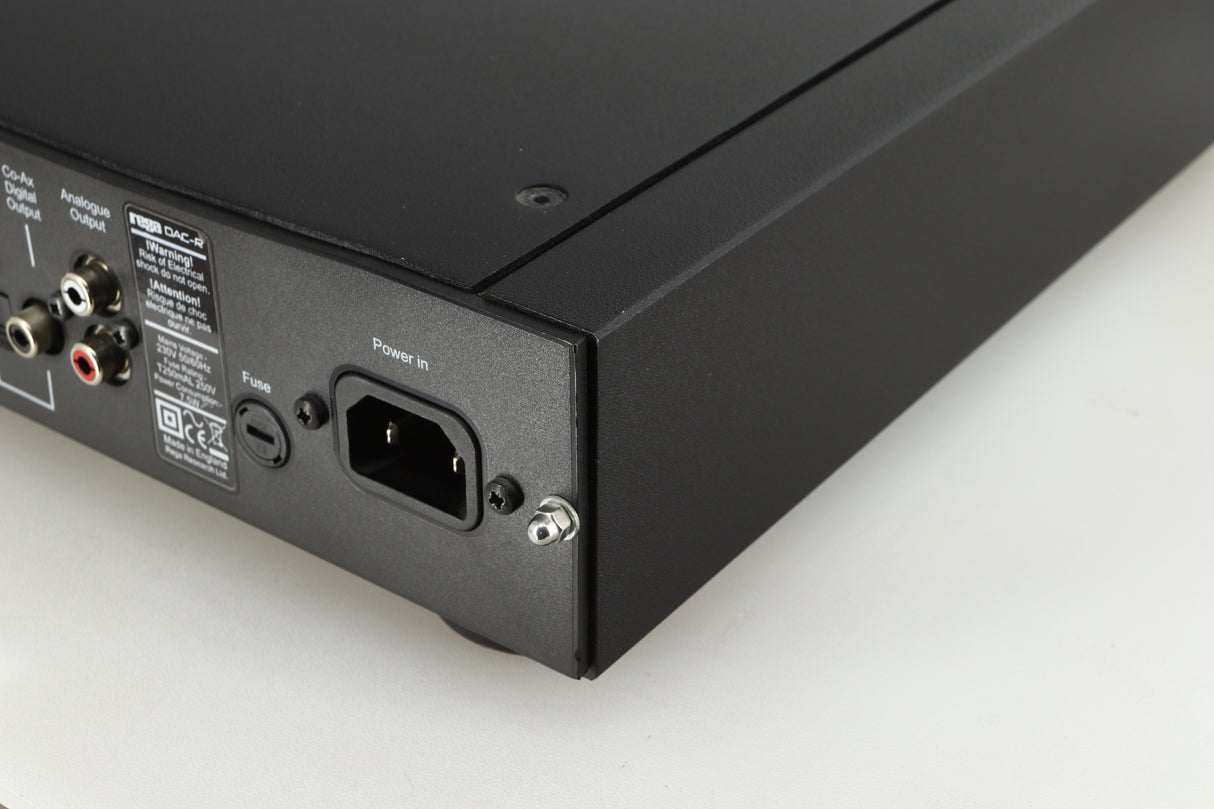 Rear left corner of a used Rega DAC-R Digital Analogue Converter in a black finish