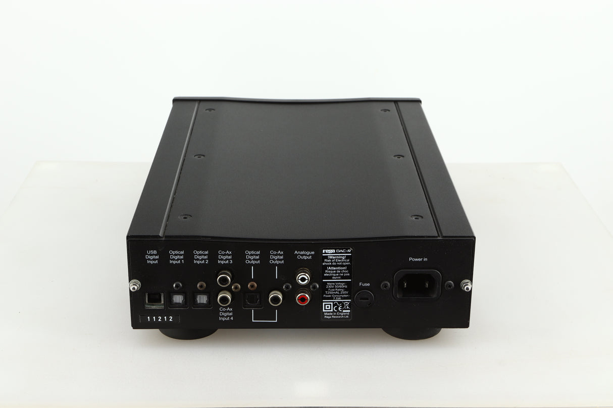 Rear view of a used Rega DAC-R Digital Analogue Converter in a black finish showing Analogue Outputs, Mains Input, Optical Digital Outputs and Inputs and USB Digital Input