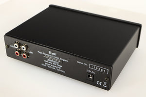 Close up of a used Rega EAR Headphone Amplifier in a black finish showing small nick on rear edge