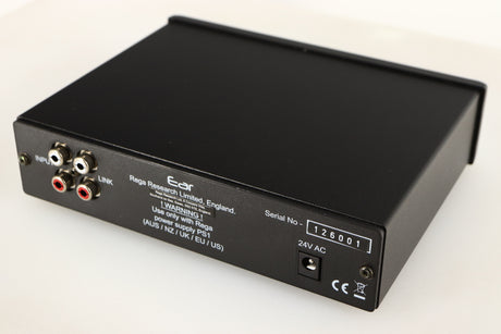 Close up of a used Rega EAR Headphone Amplifier in a black finish showing small nick on rear edge