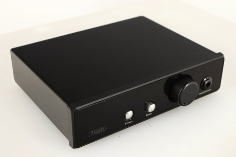 Close up of a used Rega EAR Headphone Amplifier in a black finish showing some scratching on screen
