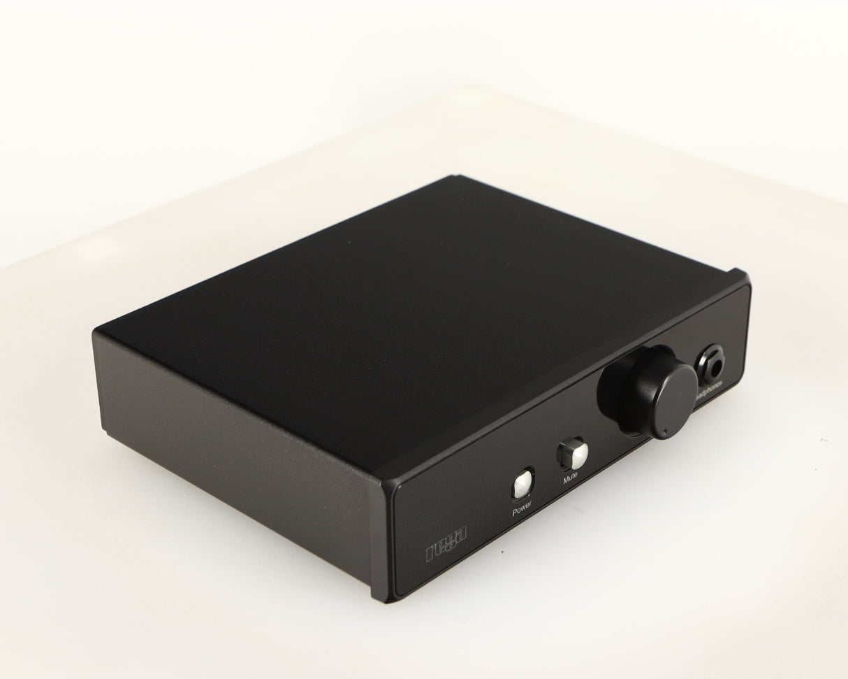 Front left corner of a used Rega EAR Headphone Amplifier in a black finish