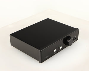 Front left corner of a used Rega EAR Headphone Amplifier in a black finish
