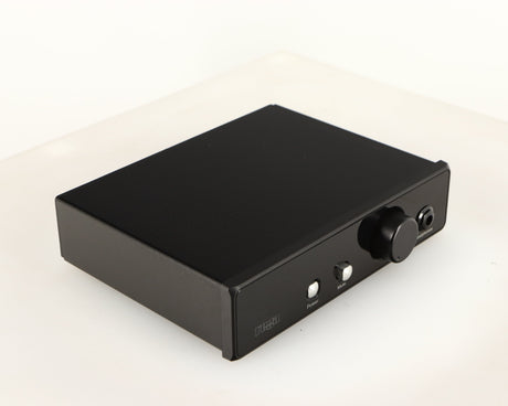 Front left corner of a used Rega EAR Headphone Amplifier in a black finish