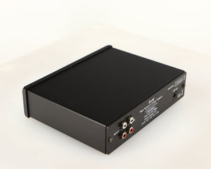 Rear right corner of a used Rega EAR Headphone Amplifier in a black finish
