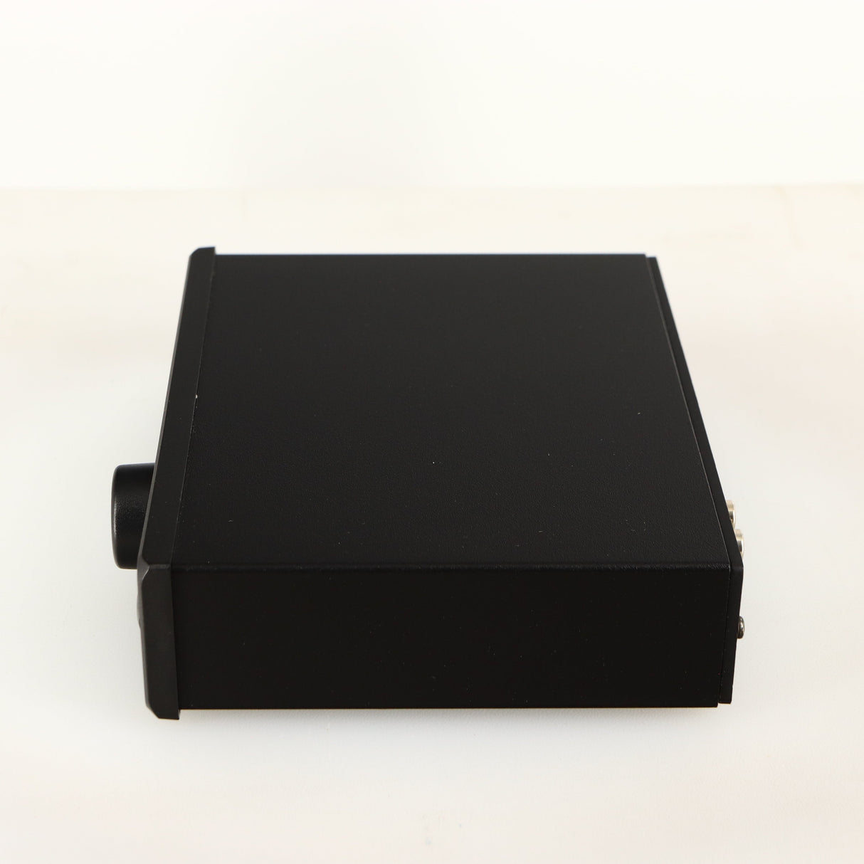 Right side view of a used Rega EAR Headphone Amplifier in a black finish