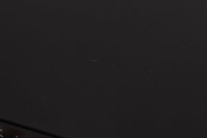 Close up of a used Rega Elex MK4 Integrated Amplifier in a Black finish showing scratches on top