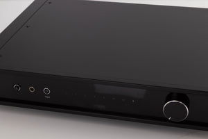 Close up of a used Rega Elex MK4 Integrated Amplifier in a Black finish showing scratches on screen